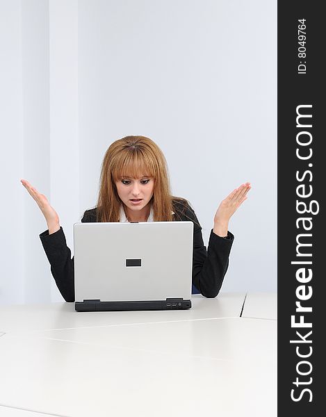 Young business woman working on a laptop.