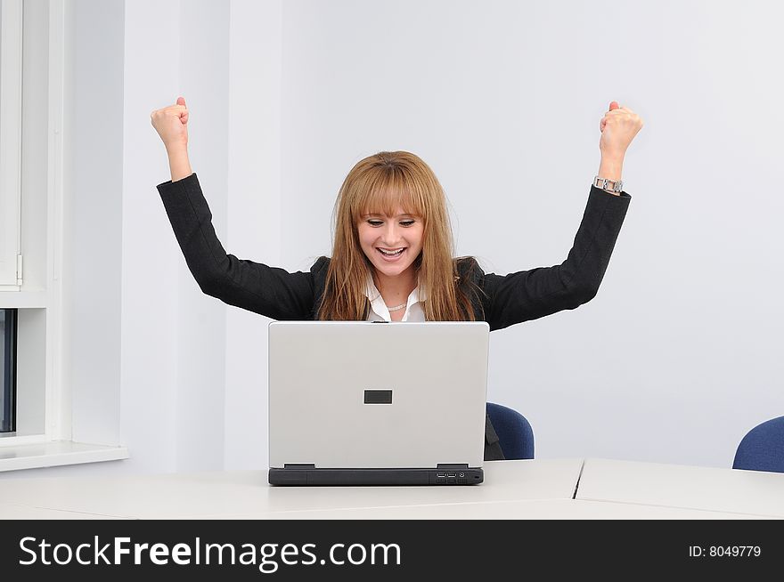 Young business woman working on a laptop.