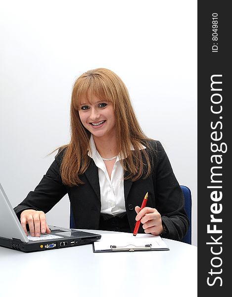 Young business woman working on a laptop.