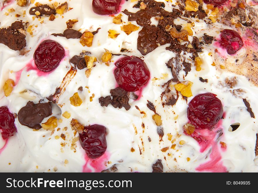 Birthday cream cake with cherries and chocolate close-up