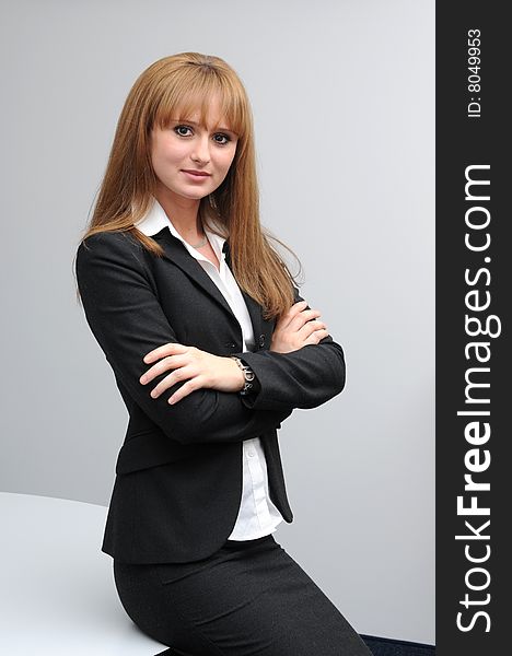 Posing young business woman. Wearing black jacket.