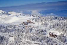 Snow Covered Mountain Side With Buildings Royalty Free Stock Photos