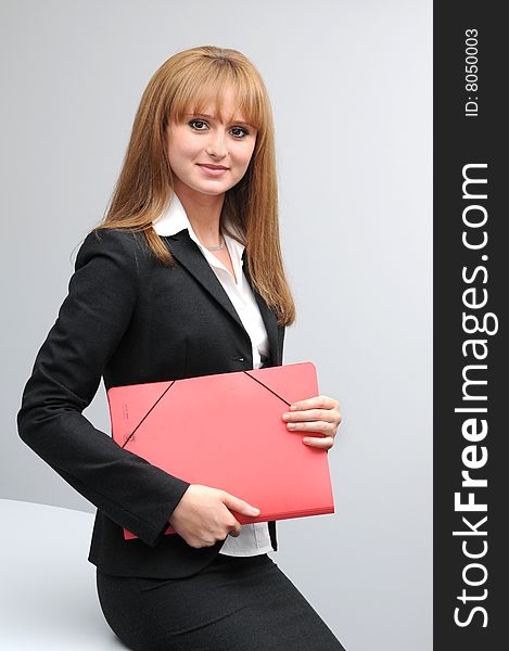 Posing young business woman. Wearing black jacket.