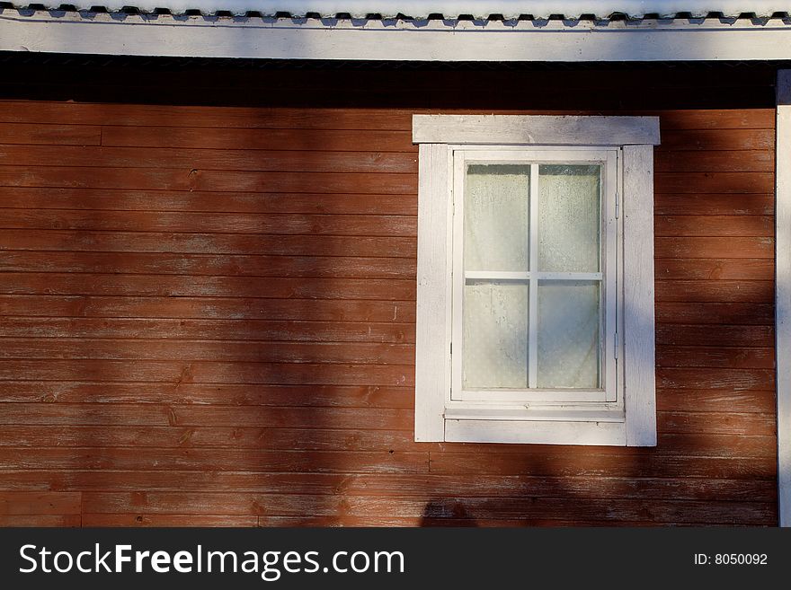 Window in red wooden wall, can be used for copy text. Window in red wooden wall, can be used for copy text