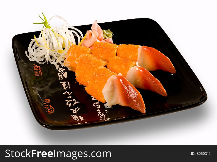 Sushi on a plate with black characters