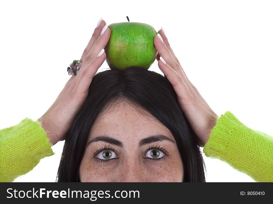 Young woman holding healthy green apple above the head isolated on white background