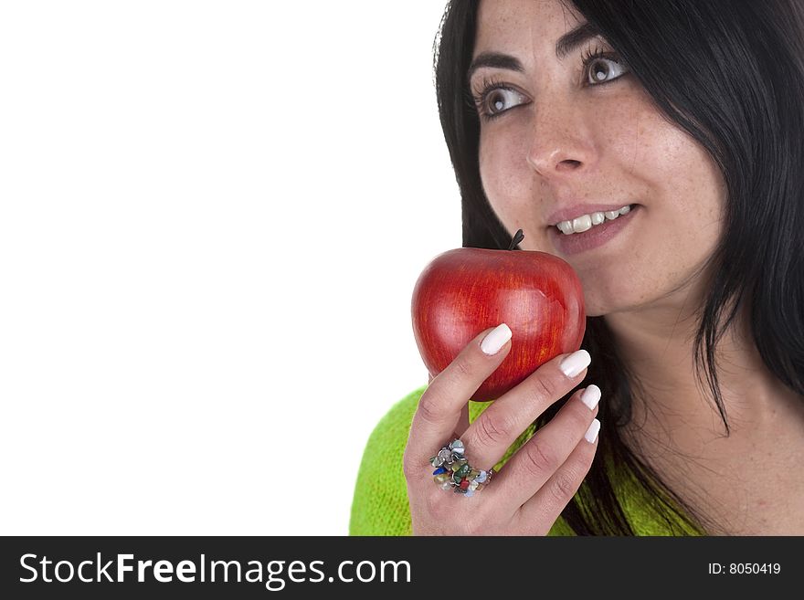 Young woman holding healthy red apple in the hands isolated on white background