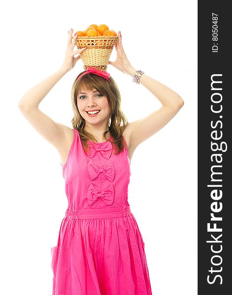 Beautiful girl with a basket full of tangerines