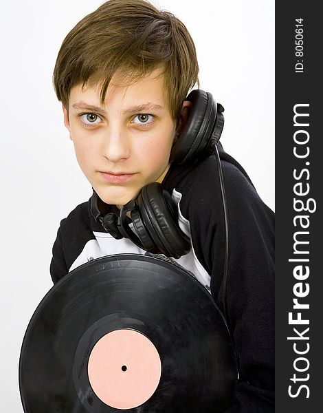 Young man with headphones and viyil plate. Young man with headphones and viyil plate