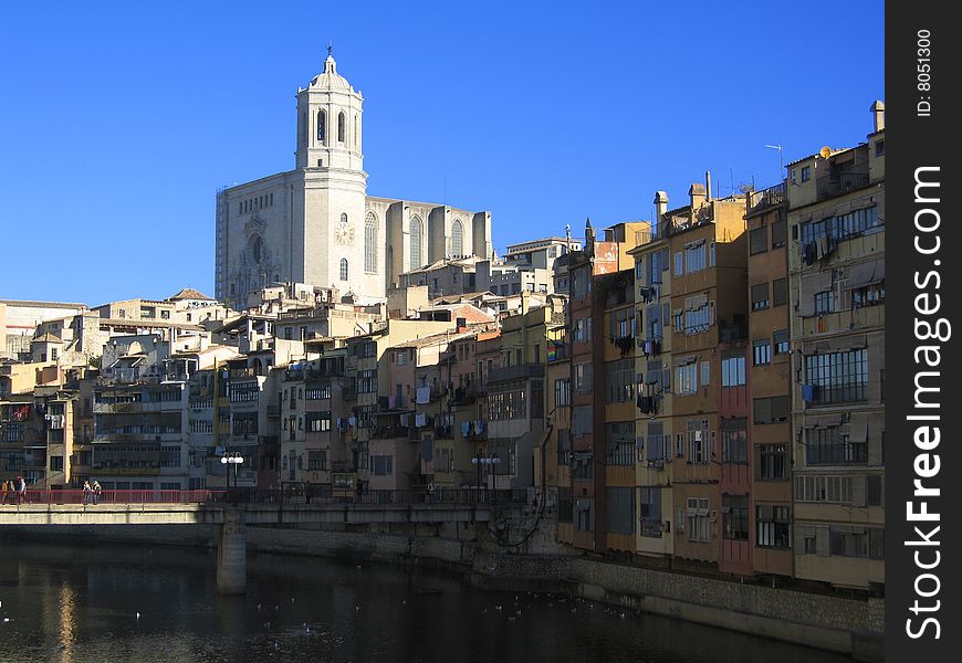 Girona tower above other houses with the river. Girona tower above other houses with the river