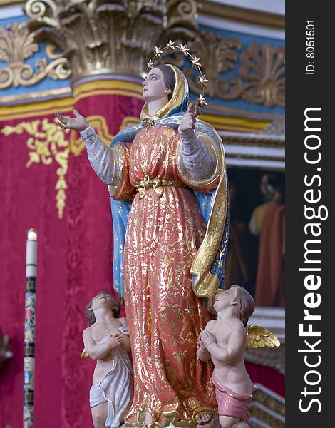 St. Mary with two little cherubins statue in maltese church. St. Mary with two little cherubins statue in maltese church