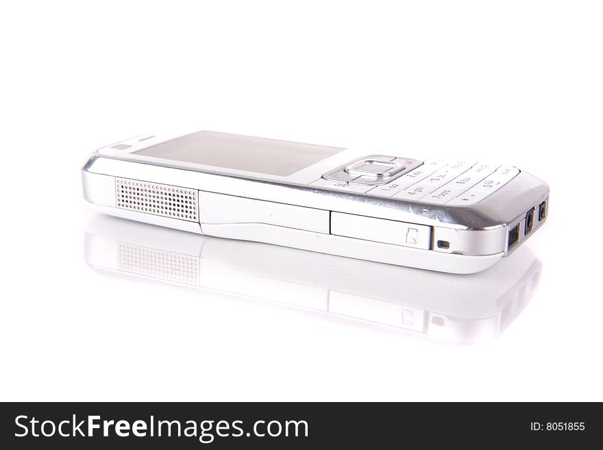 Isolated shot of a white cell phone. The phone is mirrored and isolated over pure white. Lot of copyspace. Isolated shot of a white cell phone. The phone is mirrored and isolated over pure white. Lot of copyspace.