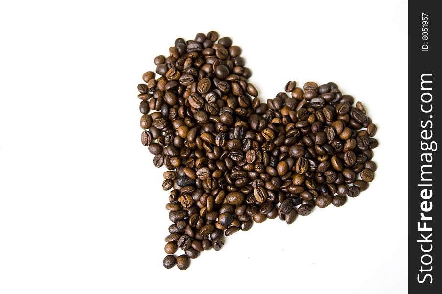 Heart shaped coffee beans isolated on white
