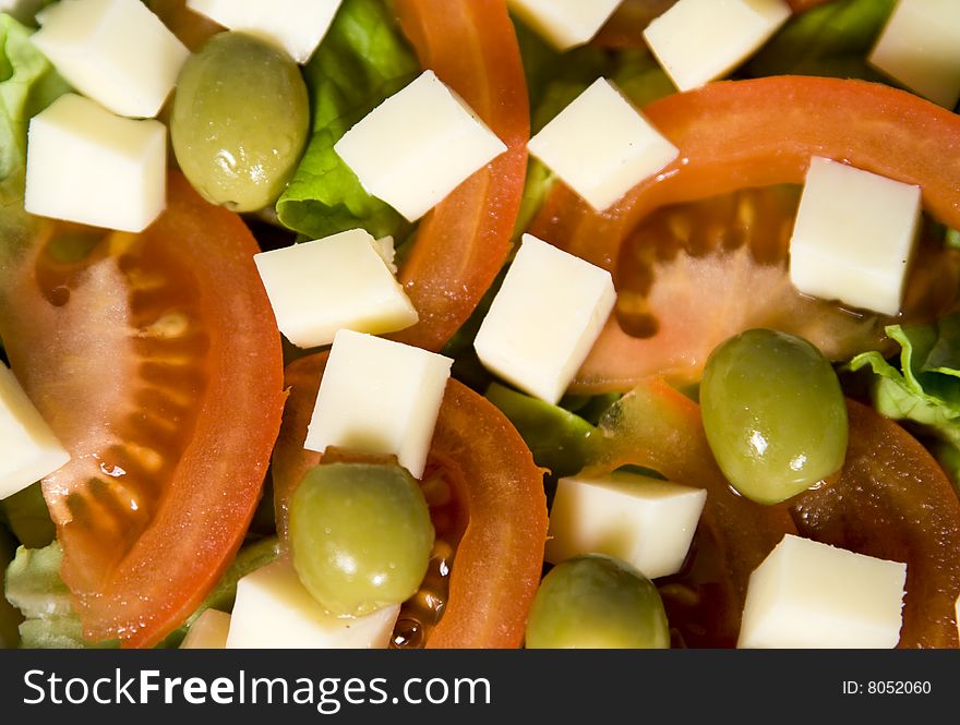 Fresh colorful salad with lettuce, tomatoes and cheese. Fresh colorful salad with lettuce, tomatoes and cheese