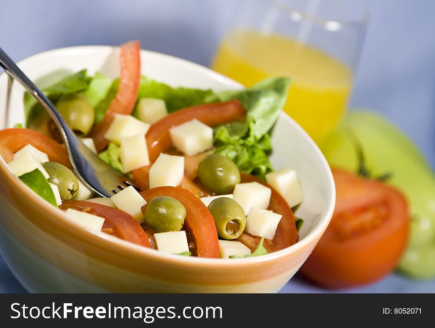Fresh colorful salad with lettuce, tomatoes and cheese. Fresh colorful salad with lettuce, tomatoes and cheese