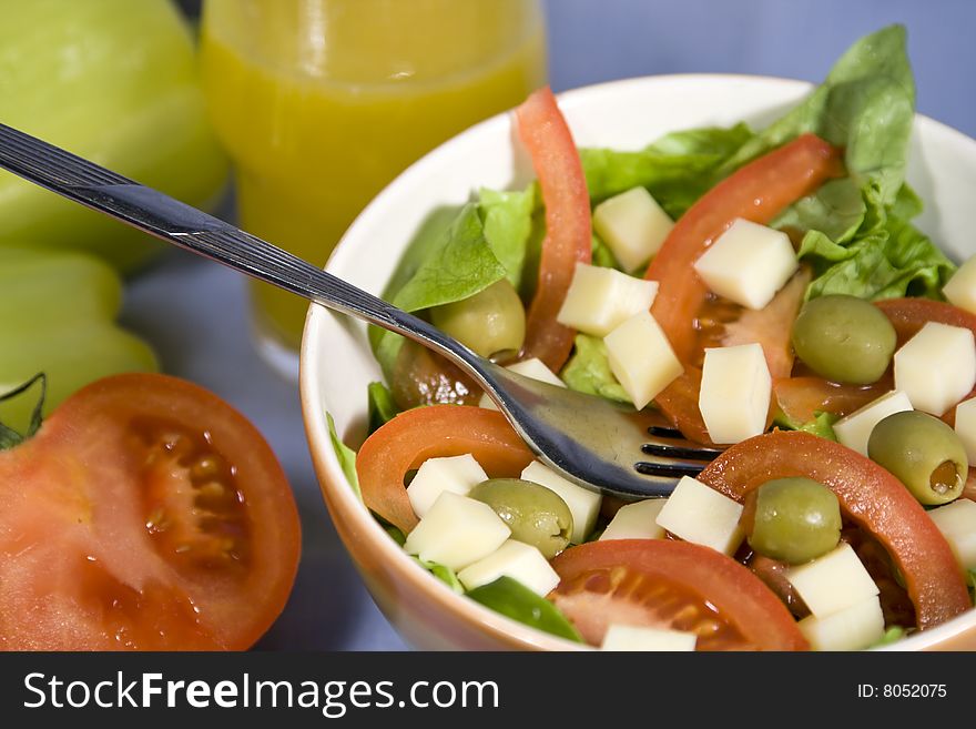 Fresh colorful salad with lettuce, tomatoes and cheese. Fresh colorful salad with lettuce, tomatoes and cheese