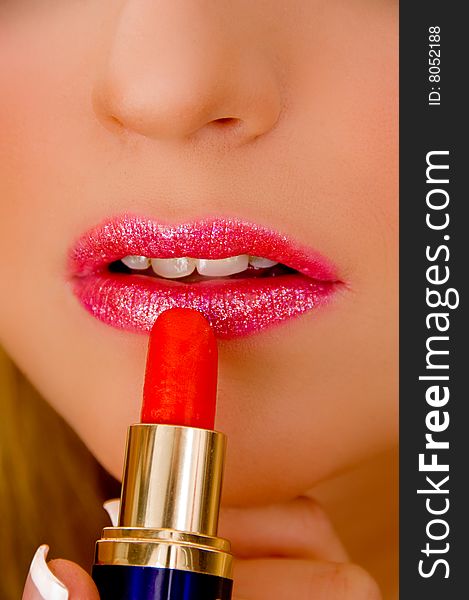 Close View Of Model Applying Lipstick