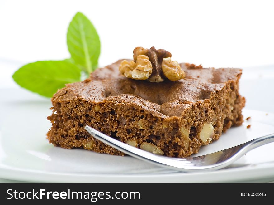 Hot chocolate brownie with walnuts and vanilla isolated