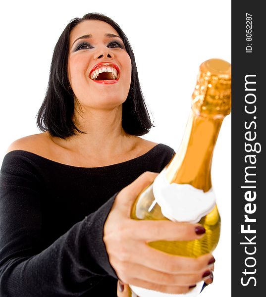 Front view of happy model holding champagne bottle on an isolated background. Front view of happy model holding champagne bottle on an isolated background