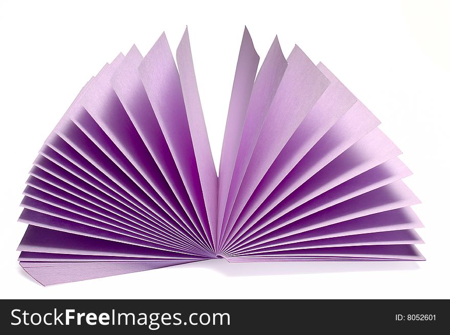 Opened stack of notes violet colors isolated on white