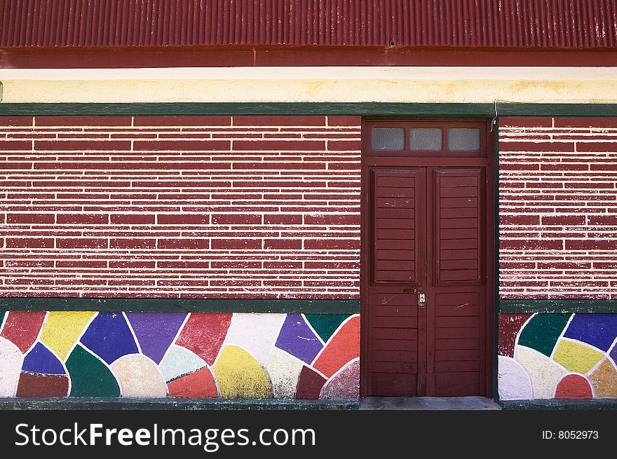 Colorful Tile And Dark Red Door