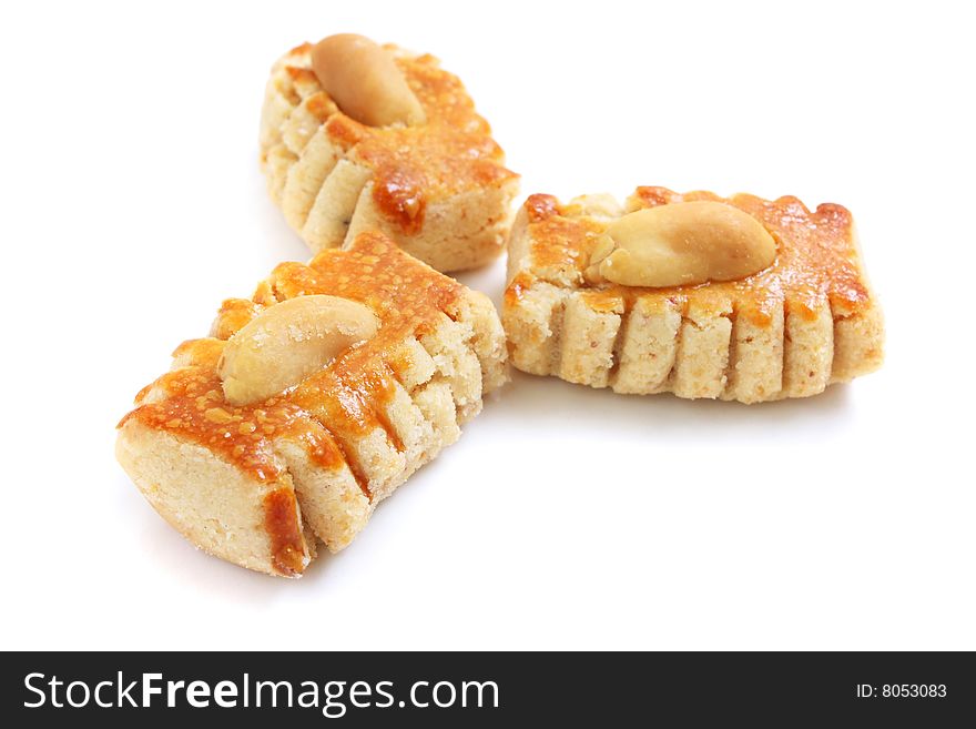 Three pieces of peanut cookies isolated over white background.