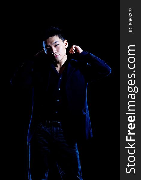 Stylish portrait of asian young guy in formal black suit. Stylish portrait of asian young guy in formal black suit