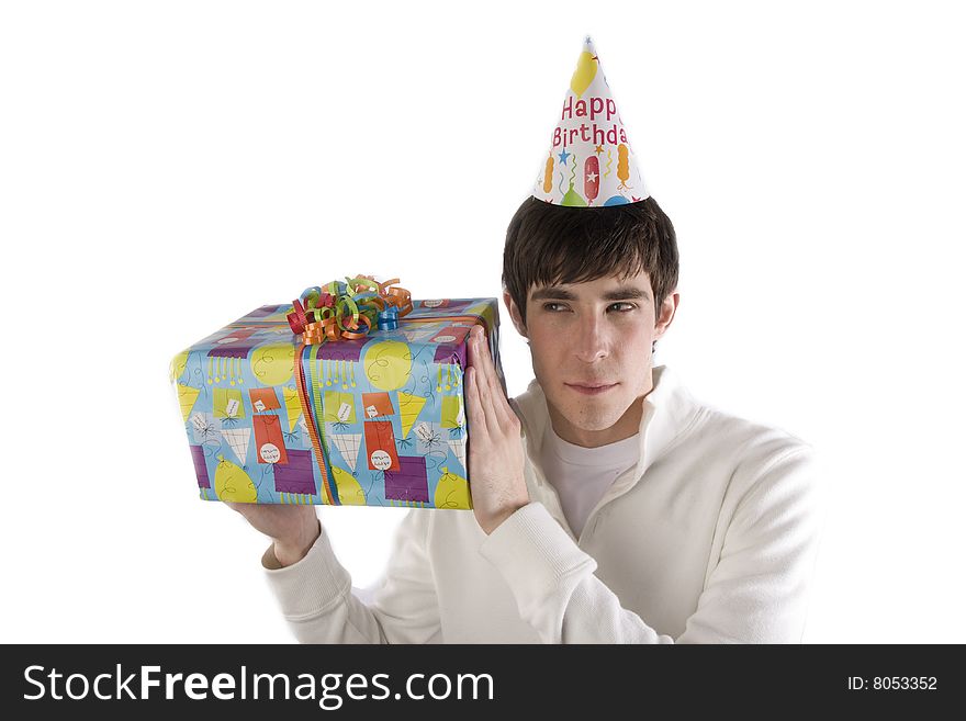 A young man guesses what his birthday gift is. A young man guesses what his birthday gift is