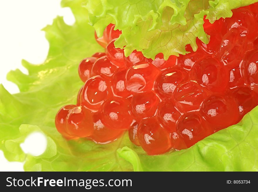 Red caviar and green lettuce. Red caviar and green lettuce.
