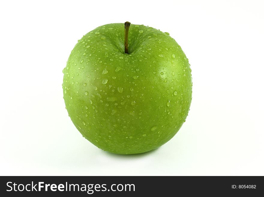 Green apple with water droplets on
white background. Green apple with water droplets on
white background