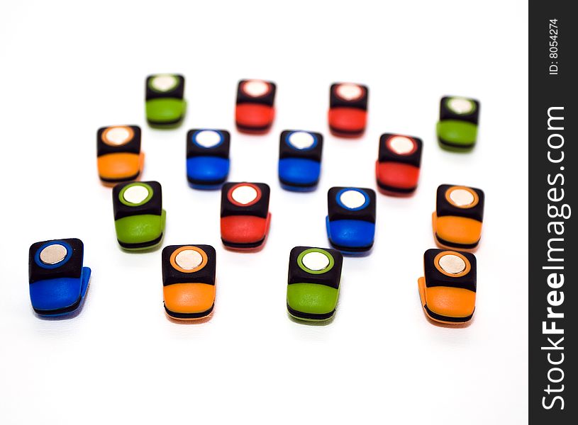 Group of colorful magetic clips on white background. Group of colorful magetic clips on white background.