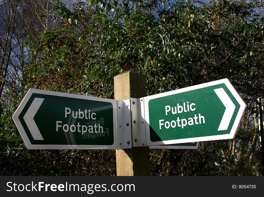 Sign pointing direction of public footpath. Sign pointing direction of public footpath