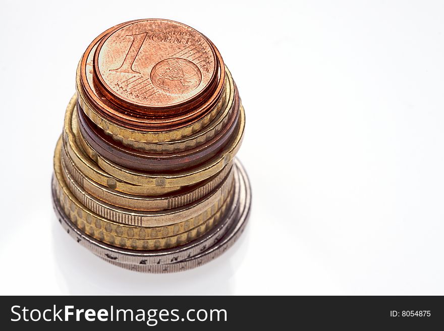 A selection of euro coins on a white background