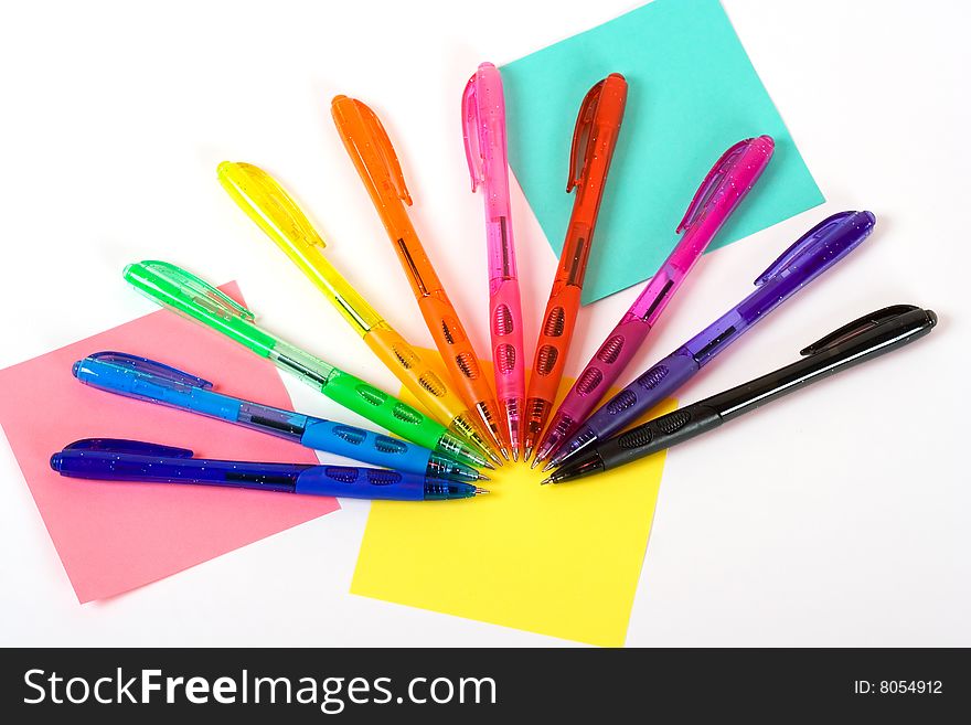A photo of ten plastic pens of different colors. A photo of ten plastic pens of different colors