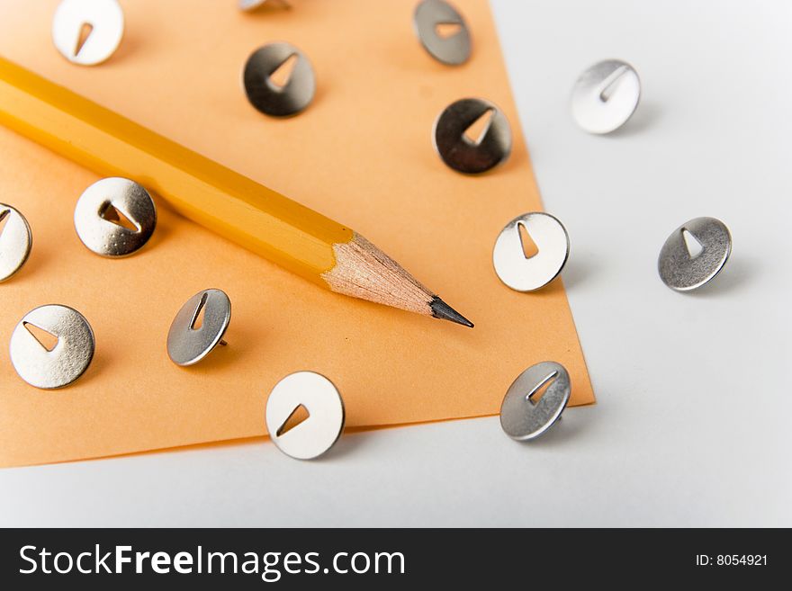 A photo of a yellow pencil with knobs