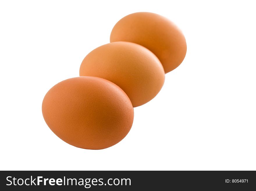 Three eggs on a white background without shadows
