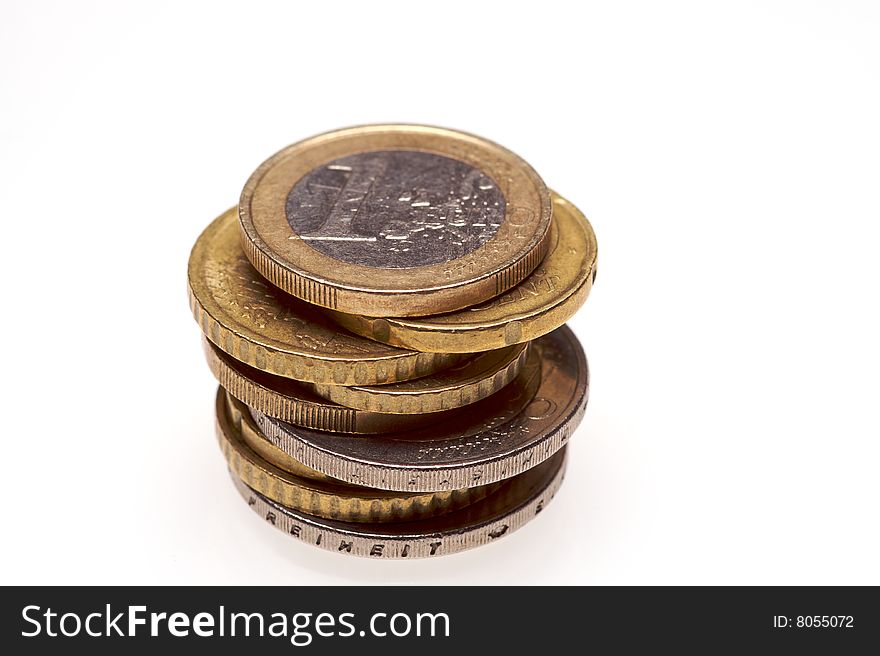 A stack of a selection of euro coins on a white background. A stack of a selection of euro coins on a white background