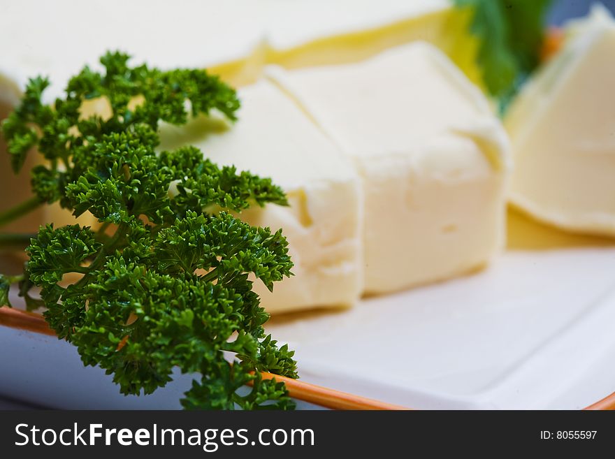 Stock photo: an image of yellow butter and green parsley