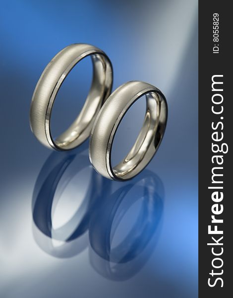 A pair of white gold wedding rings. A pair of white gold wedding rings
