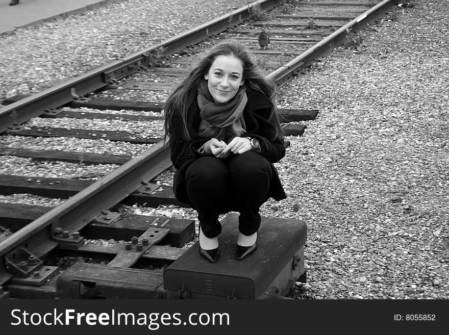 Girl Sitting Near Railroad