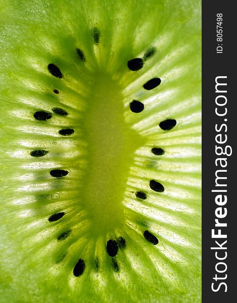 Green kiwi close up with seeds