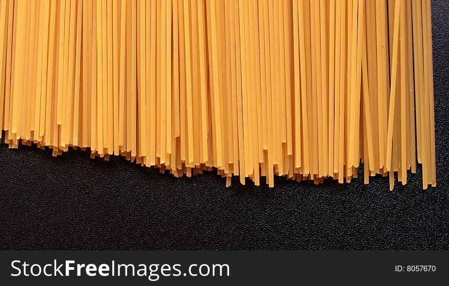 Italian spaghetti on a black background