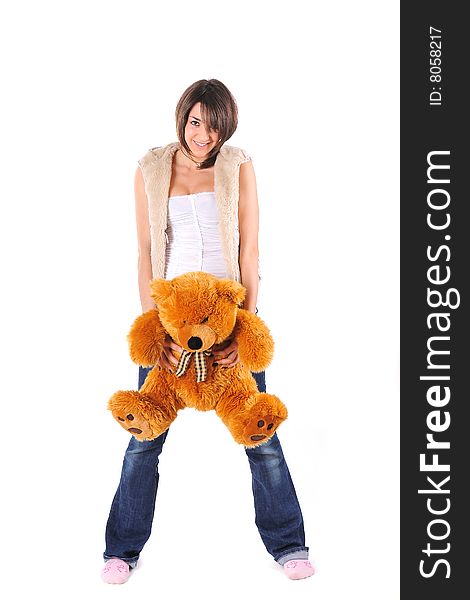 Girl hugging a Teddy bear on white background. Girl hugging a Teddy bear on white background
