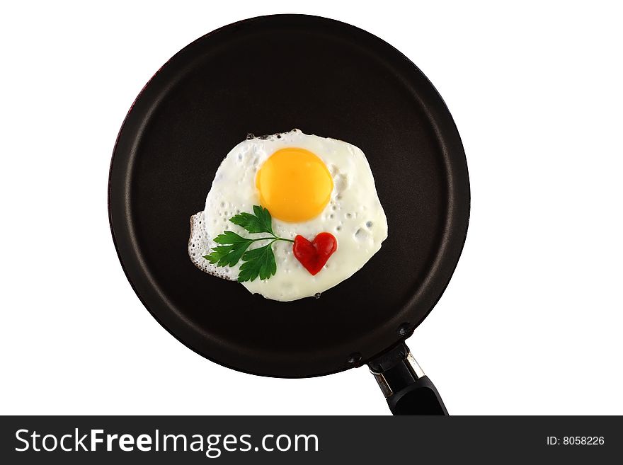 Fryed egg with ketchup and parsley