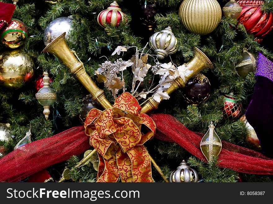Christmas tree with nice decorations including horns and ribbons. Christmas tree with nice decorations including horns and ribbons