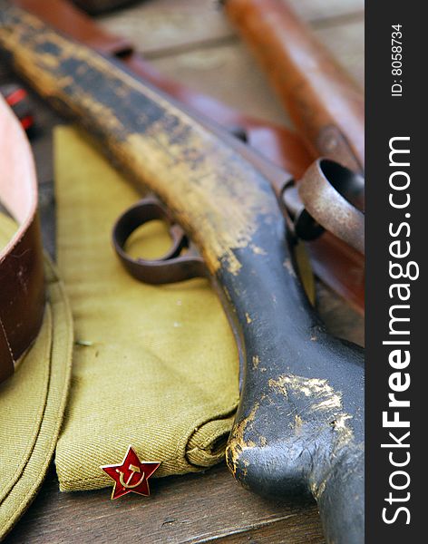 World war II soviet soldier field cap and rifle closeup. World war II soviet soldier field cap and rifle closeup