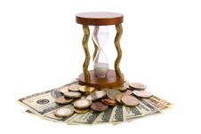 Dollars And Hourglass On White. Stock Photography