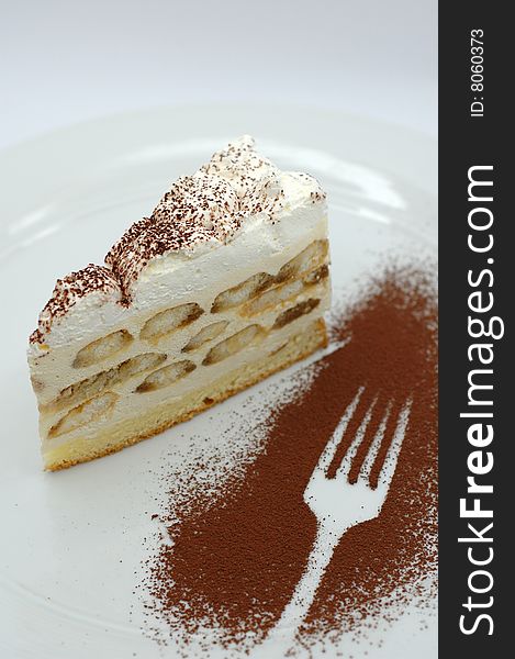 Delicious tiramisu with cream and cocoa powder