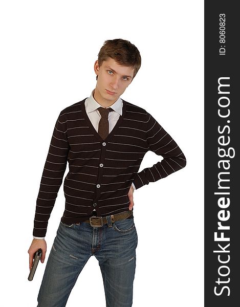 Serious young man holding a gun. Isolated.