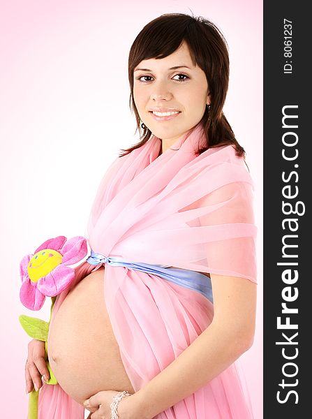 Belly and hand of the pregnant woman on pink background. Belly and hand of the pregnant woman on pink background